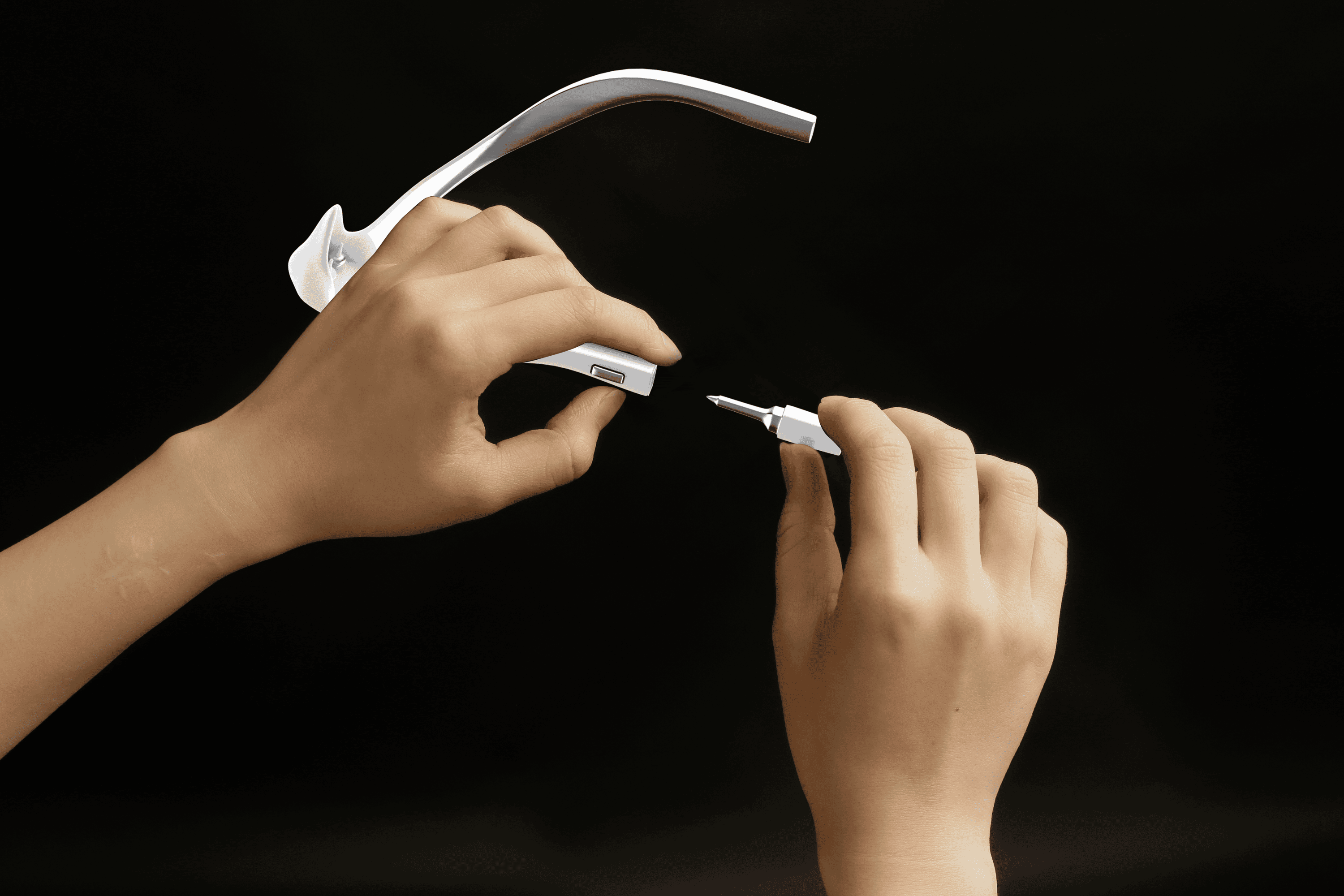 Close detail view of the Sentverse wearable device in hand